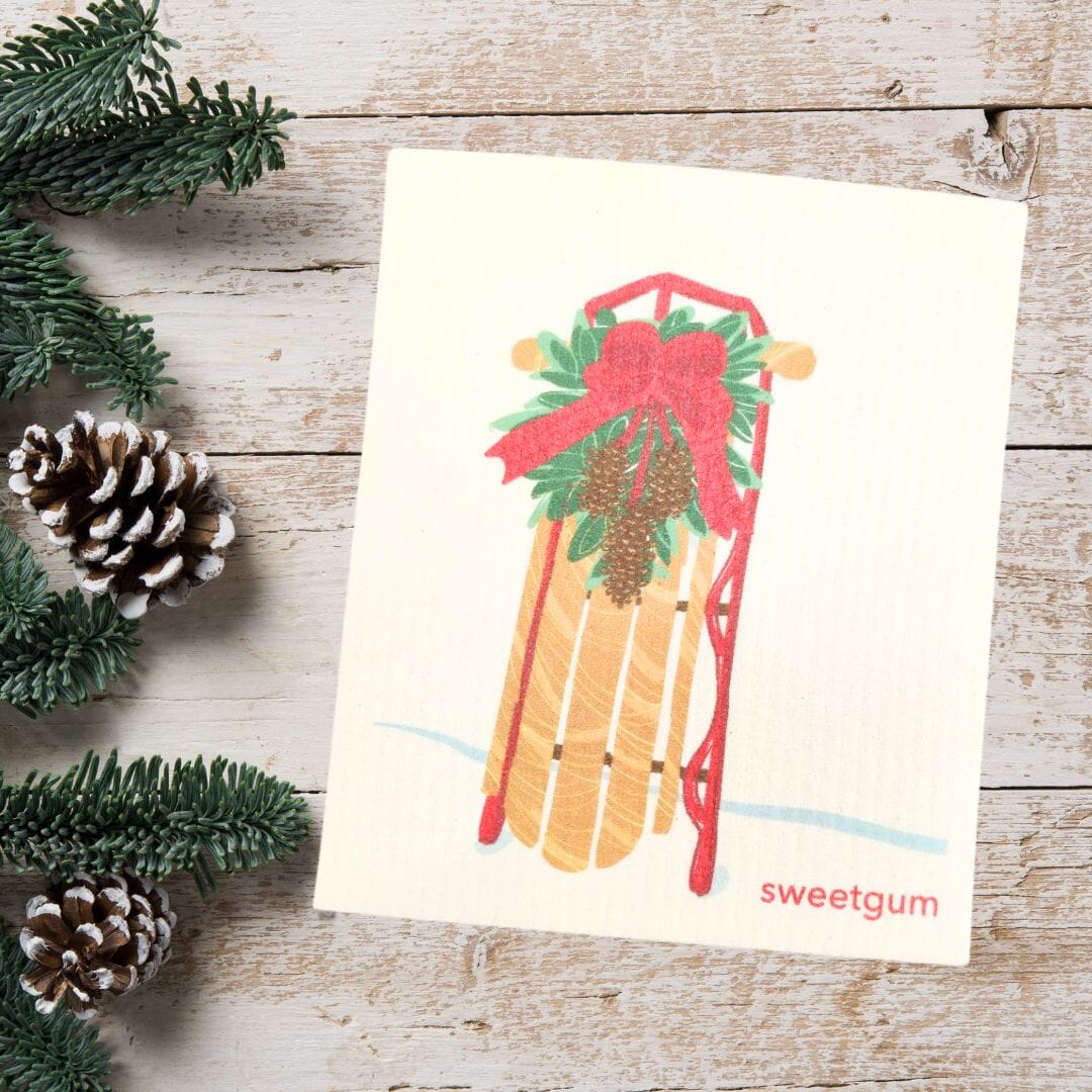 Sled with Red Bow & Pinecone Swag | Christmas & Winter Swedish Dishcloth Swedish Dishcloths sweetgum textiles company, LLC 