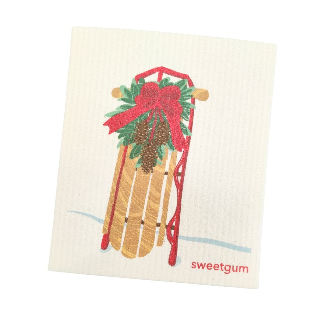 Sled with Red Bow & Pinecone Swag Swedish Dishcloth | Christmas & Winter Swedish Dishcloths sweetgum textiles company, LLC 