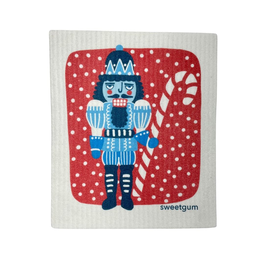 https://sweetgumhome.com/cdn/shop/products/blue-nutcracker-swedish-dishcloth-red-background-with-snow-swedish-dishcloths-sweetgum-textiles-company-llc-840345_1600x.jpg?v=1689769041